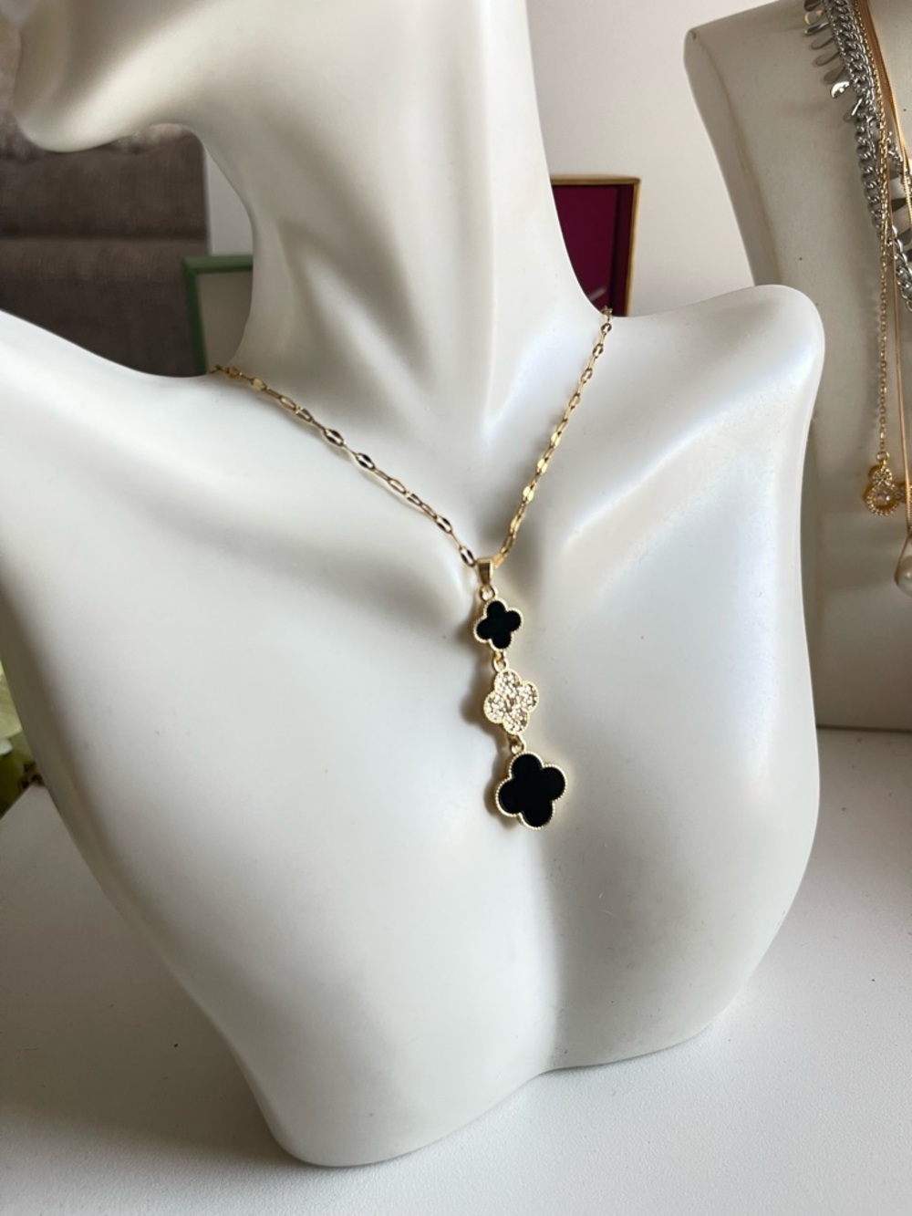 Gold Necklace with Black Clover Pendants